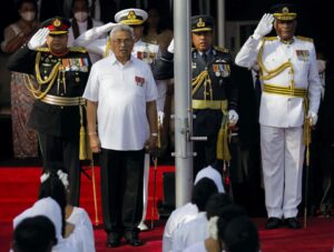 Sri Lanka’s Gotabaya Rajapaksa sings the national anthem during the country’s 74th Independence Day celebrations in Colombo, Sri Lanka February 4, 2022. He resigned as president this month after fleeing the country. REUTERS/Dinuka Liyanawatte
