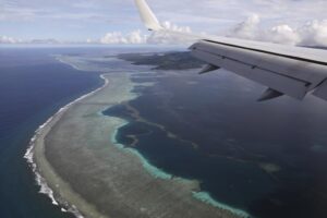 The aerial photo shows Pohnpei International Airport in Kolonia, Federated States of Micronesia, on Aug. 5, 2019. Micronesia has likely become the final nation in the world with a population of more than 100,000 to experience an outbreak of COVID-19. On Tuesday, July 19, 2022, the government announced it had become aware of multiple cases across two of the nation’s four states.(Jonathan Ernst/Pool Photo via AP, File)