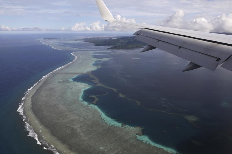 The aerial photo shows Pohnpei International Airport in Kolonia, Federated States of Micronesia, on Aug. 5, 2019. Micronesia has likely become the final nation in the world with a population of more than 100,000 to experience an outbreak of COVID-19. On Tuesday, July 19, 2022, the government announced it had become aware of multiple cases across two of the nation’s four states.(Jonathan Ernst/Pool Photo via AP, File)