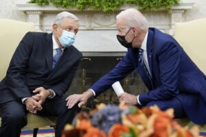 FILE – President Joe Biden meets with Mexican President Andrés Manuel López Obrador in the Oval Office of the White House in Washington, Nov. 18, 2021. President Andrés Manuel López Obrador will visit Washington Tuesday, July 12, 2022, to meet with President Joe Biden, a month after López Obrador snubbed Biden’s invitation to the Summit of the Americas in Los Angeles. (AP Photo/Susan Walsh, File)