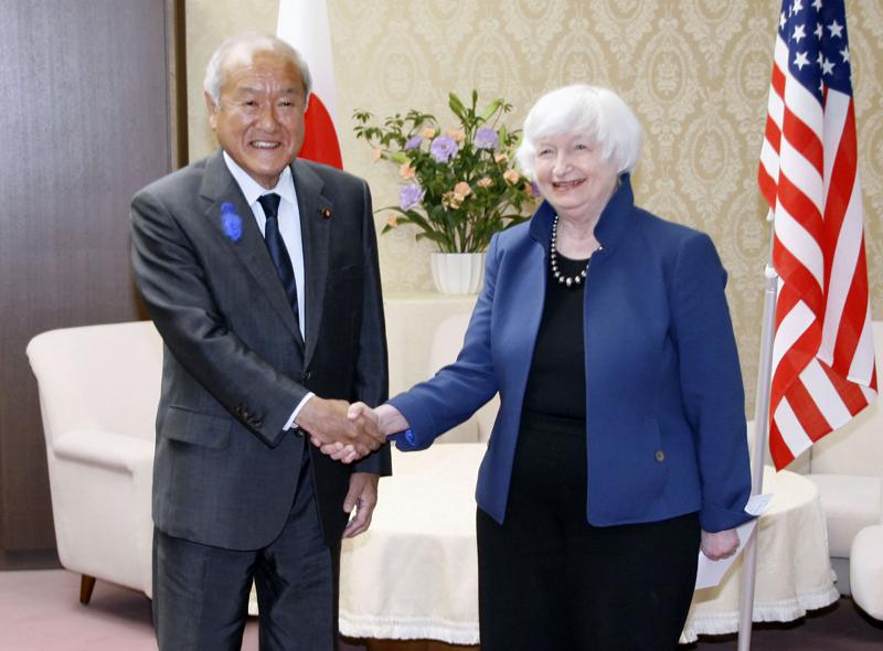 U.S. Treasury Secretary Janet Yellen, right, and Japan’s Finance Minister Shunichi Suzuki shake hands during their meeting at the finance ministry in Tokyo, Tuesday, July 12, 2022. With thousands of sanctions already imposed on Russia to flatten its economy, the U.S. and its allies are working on new measures to starve the Russian war machine while also stopping the price of oil and gasoline from soaring to levels that could crush the global economy. (Kyodo News via AP)