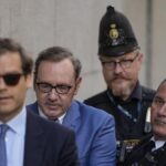 Actor Kevin Spacey, center, arrives at the Old Bailey, in London, Thursday, July 14, 2022. Spacey appeared Thursday in a court in London after he was charged with sexual offenses against three men. The 62-year-old Spacey is accused of four counts of sexual assault and one count of causing a person to engage in penetrative sexual activity without consent. (AP Photo/Frank Augstein)