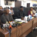 Prof Mahmood Yakubu (L) and Members of the Commission at a special meeting of the Inter-agency Consultative Committee on Election Security (ICCES) to review security arrangements for Osun election slated for July 16, 2022