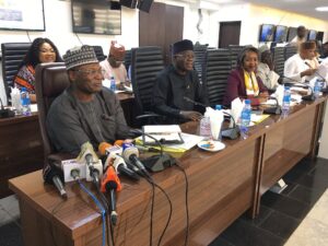 Prof Mahmood Yakubu (L) and Members of the Commission at a special meeting of the Inter-agency Consultative Committee on Election Security (ICCES) to review security arrangements for Osun election slated for July 16, 2022