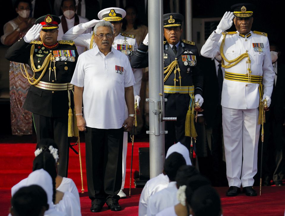 Sri Lanka’s Gotabaya Rajapaksa sings the national anthem during the country’s 74th Independence Day celebrations in Colombo, Sri Lanka February 4, 2022. He resigned as president this month after fleeing the country. REUTERS/Dinuka Liyanawatte