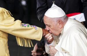 Pope Francis kisses the hand of residential school survivor Elder Alma Desjarlais of the Frog Lake First Nation as he arrives in Edmonton, Alberta, Canada, on Sunday, July 24, 2022. The pope’s visit to Canada is aimed at reconciliation with Indigenous people for the Catholic Church’s role in residential schools. (Nathan Denette/The Canadian Press via AP)