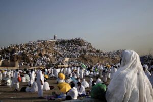 FILE – Muslim pilgrims pray on a rocky hill known as Mountain of Mercy, on the Plain of Arafat, during the annual hajj pilgrimage, near the holy city of Mecca, Saudi Arabia, on Sept. 11, 2016. Police in Mecca say they have arrested a Saudi man who helped an Israeli-Jewish reporter sneak into the city, defying a rule that only Muslims can enter the area that is home to Islam’s holiest site. (AP Photo/Nariman El-Mofty, File)