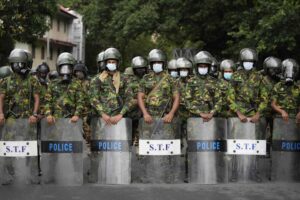 Police commandos stand guard at a barricade outside president’s office in Colombo, Sri Lanka, Friday, July 22, 2022. (AP Photo/Eranga Jayawardena)