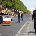 French President Emmanuel Macron reviews the troops during the annual Bastille Day military parade, in Paris, Thursday, July 14, 2022. France is celebrating its national holiday with thousands of French troops marching down the Champs-Elysees avenue alongside allies from Eastern Europe. (Sarah Meyssonnier, pool via AP)