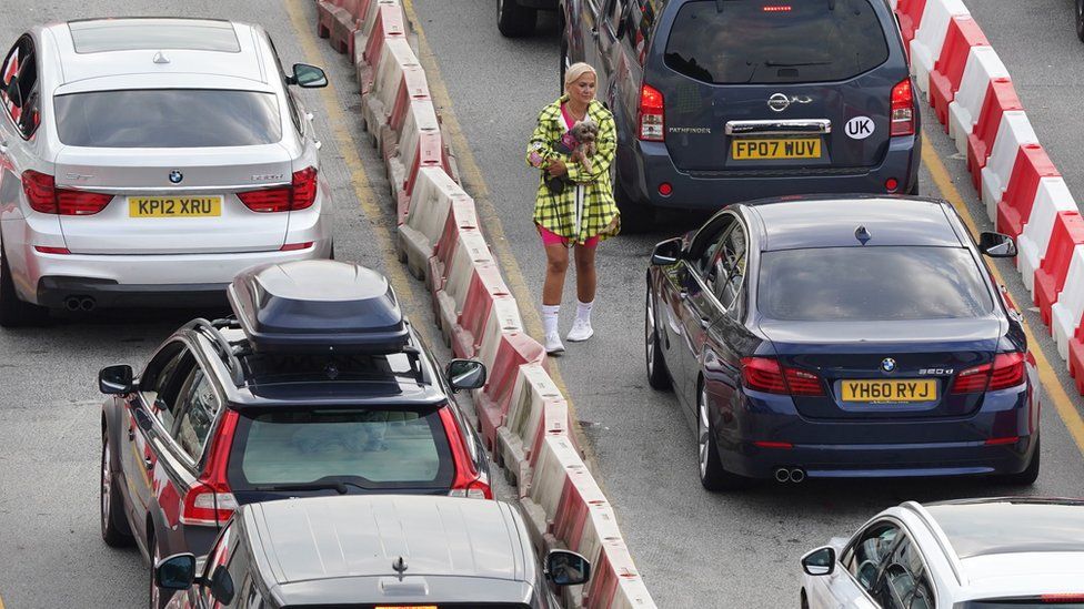 Holidaymakers and hauliers are being warned of another day of disruption at the Port of Dover and the Channel Tunnel after two days of gridlock.