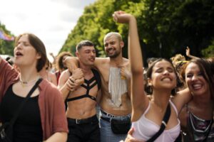 Revelers dance as they take part in the annual pride march in Berlin, Germany, Saturday, July 23, 2022. Draped in rainbow flags, around 150,000 people were marching for LGBTQ rights at Berlin’s annual Christopher Street Day celebration. Berlin police gave the crowd estimate on Saturday afternoon but said the number could grow into the evening. (AP Photo/Markus Schreiber)