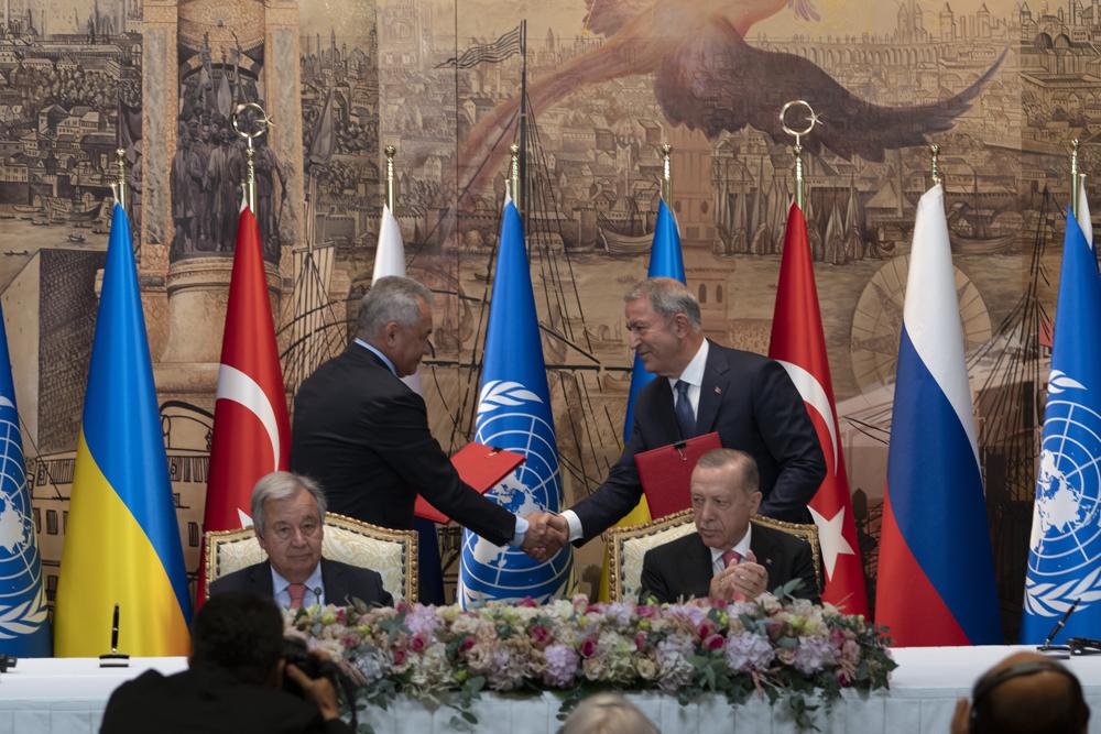 Turkish President Recep Tayyip Erdogan, right, and U.N. Secretary General, Antonio Guterres, sit as Sergei Shoigu, Russia’s Defense Minister, and Hulusi Akar, Turkey’s Defense Minister. shake hands during a signing ceremony at Dolmabahce Palace in Istanbul, Turkey, Friday, July 22, 2022. U.N. Secretary General Antonio Guterres and Turkish President Recep Tayyip Erdogan were due on Friday to oversee the signing of a key agreement that would allow Ukraine to resume its shipment of grain from the Black Sea to world markets and for Russia to export grain and fertilizers, ending a standoff that has threatened world food security. (AP Photo/Khalil Hamra)
