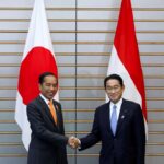 Joko Widodo, Indonesia’s President, and Fumio Kishida, Japan’s Prime Minister, shake hands during a summit meeting at the prime minister’s official residence in Tokyo, Japan, July 27, 2022. Kiyoshi Ota/Pool via REUTERS