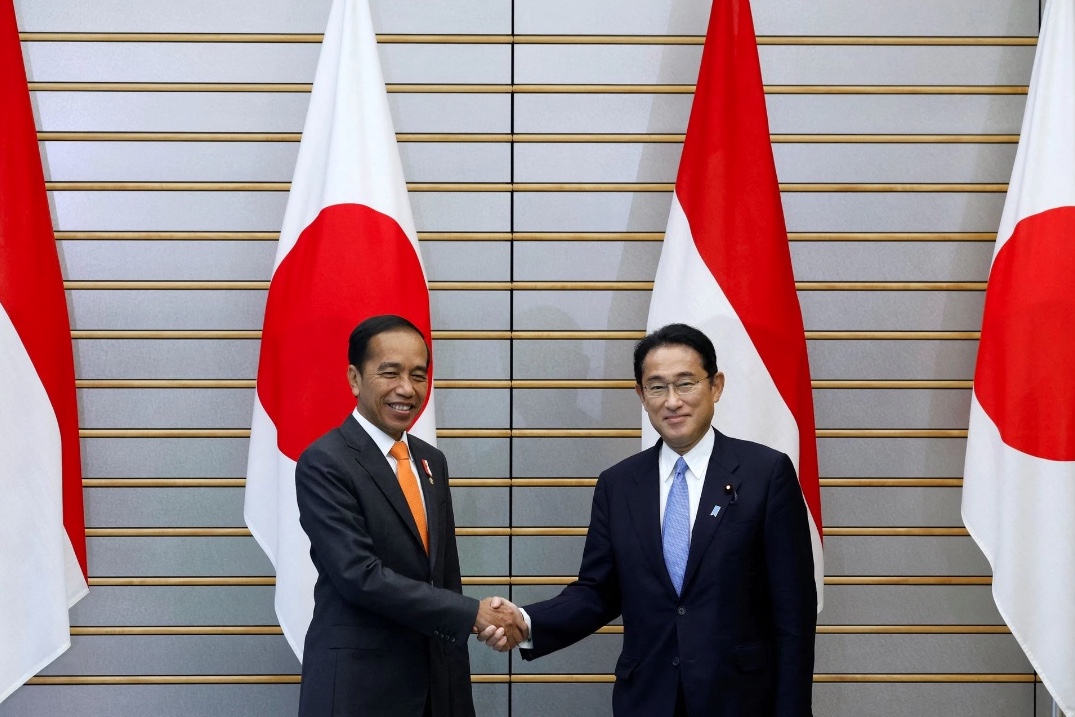 Joko Widodo, Indonesia’s President, and Fumio Kishida, Japan’s Prime Minister, shake hands during a summit meeting at the prime minister’s official residence in Tokyo, Japan, July 27, 2022. Kiyoshi Ota/Pool via REUTERS
