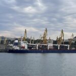 In this photo provided by the Ukrainian Infrastructure Ministry Press Office, the Razoni cargo ship, under the flag of Sierra Leone, with 26,000 tons of the Ukrainian corn aboard, leaves the port in Odesa region, Ukraine, Monday, Aug. 1, 2022. The first ship carrying Ukrainian grain set off from the port of Odesa on Monday under an internationally brokered deal and is expected to reach Istanbul on Tuesday, where it will be inspected, before being allowed to proceed. (Ukrainian Infrastucture Ministry Press Office via AP)