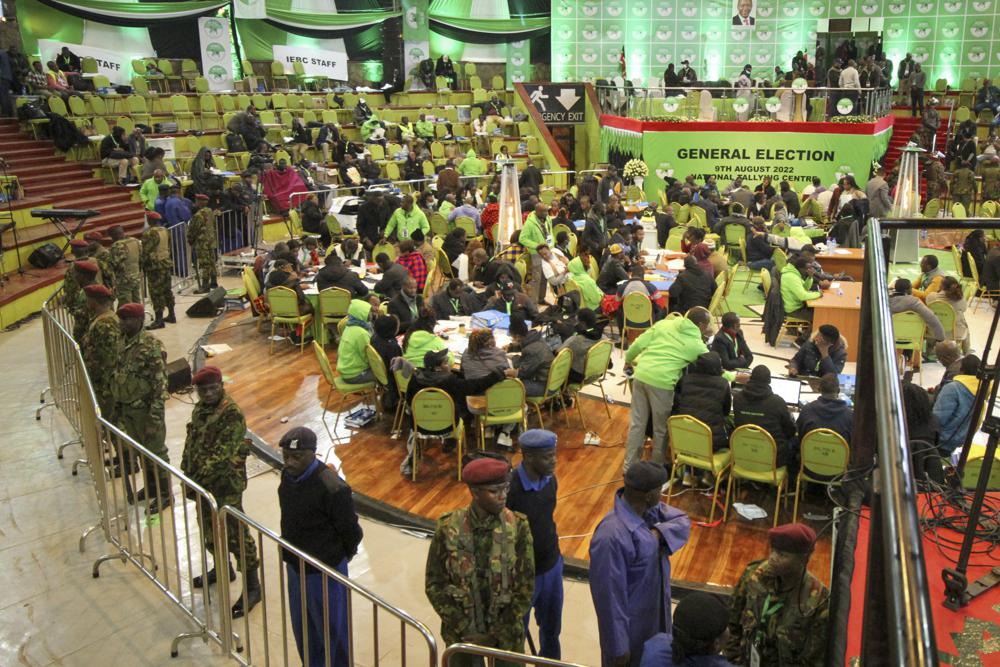 Police are deployed to provide security after scuffles broke out between political party agents and police at the electoral commission’s national tallying center in Nairobi, Kenya late night Saturday, Aug. 13, 2022. Kenya’s peaceful presidential election saw a brief disruption late Saturday when police responded to scuffles at the national tallying center amid tensions over the close results. (AP Photo)