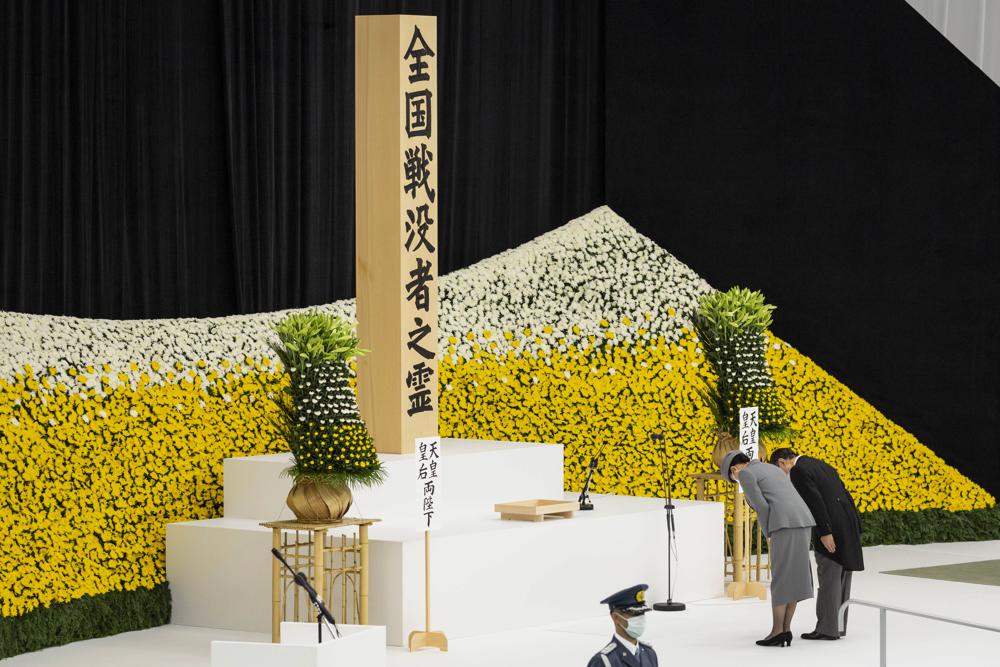 Japan’s Emperor Naruhito and Empress Masako bow as they attend a memorial service marking the 77th anniversary of Japan’s World War II defeat, at the Nippon Budokan hall in Tokyo, Monday, Aug. 15, 2022. (Yuichi Yamazaki/Pool Photo via AP)