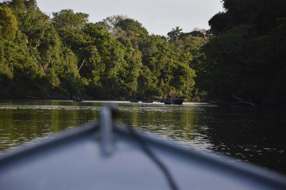 In this July 22, 2019 photo provided by Rodrigo Vargas, a boat moves through the in Cristalino II State Park in the state of Mato Grosso, in Brazil. In a move that shocked environmentalists, the government of Brazil’s third-largest state gave up on a legal battle to protect the state park located in one of the Amazon’s most biodiverse areas. Now the park will be officially dissolved, its press office confirmed to The Associated Press. (Rodrigo Vargas via AP)