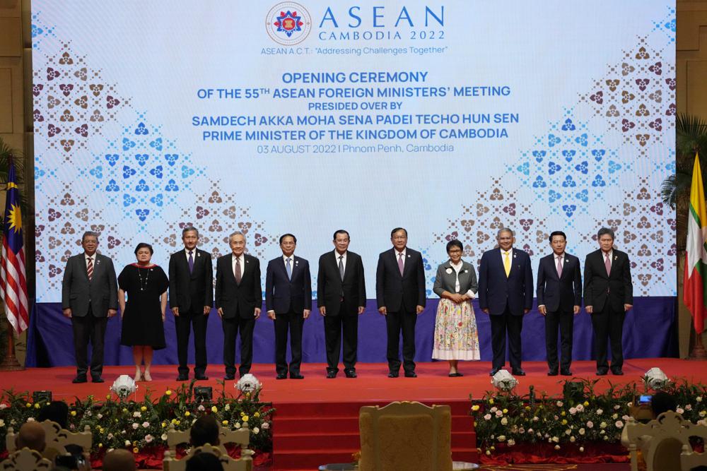 From left to right; Malaysian Foreign Minister Saifuddin Abdullah, Philippines Foreign Affairs acting Undersecretary Theresa Lazaro, Singapore Foreign Minister Vivian Balakrishnan, Thailand’s Foreign Minister Don Pramudwinai, Vietnam Foreign Minister But Thanh Son, Cambodia’s Prime Minister Hun Sen, Cambodia’s Foreign Minister Peak Sokhonn, Indonesia’s Foreign Minister Retno Marsudi, Brunei Second Minister of Foreign Affair Erywan Yusof, Laos Foreign Minister Saleumxay Kommasith, and Secretary-General of ASEAN Lim Jock Hoi poses for a group photograph during the opening for the 55th ASEAN Foreign Ministers’ Meeting (55th AMM) in Phnom Penh, Cambodia, Wednesday, Aug. 3, 2022. (AP Photo/Heng Sinith)