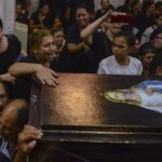 FILE – Mourners attend a service for victims of a fire in a crowded church that killed dozens, at the Blessed Virgin Mary Church in Warraq, greater Cairo, Sunday, Aug. 14, 2022. The fire at the Martyr Abu Sefein Church in the neighborhood of Imbaba, one of Egypt’s most densely populated, left many families devastated, striking a Christian community that is one of the world’s oldest, but is also no stranger to sadness. A minority in Egypt, Coptic Orthodox Christians have faced deadly attacks by Islamist extremists, restrictions on church building and outbursts of sectarian-motivated violence in recent decades. (AP Photo/Tarek Wajeh, File)