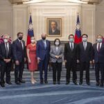In this photo released by the Taiwan Presidential Office, Taiwan’s President Tsai Ing-wen pose for photos with U.S. Congress members and other Taiwan officials during a meeting at the Presidential Office in Taipei, Taiwan on Monday, Aug. 15, 2022. The delegation of U.S. Congress members visited Taiwan parliament on Monday in a further sign of support among American lawmakers for the self-governing island. (Taiwan Presidential Office via AP)