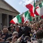 FILE — Giorgia Meloni talks with reporters in Rome’s Pantheon Square, Wednesday, March 16, 2016. With God, homeland and “natural” family prominent in her political manifesto, Giorgia Meloni, whose Fratelli d’Italia (Brothers of Italy) party with neo-fascist roots has been fast rising in popularity in view of the upcoming Sept. 25 elections for Parliament, is positioning herself to become Italy’s first far-right premier and the first woman to hold that office. (AP Photo/Alessandra Tarantino)