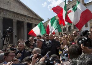 FILE — Giorgia Meloni talks with reporters in Rome’s Pantheon Square, Wednesday, March 16, 2016. With God, homeland and “natural” family prominent in her political manifesto, Giorgia Meloni, whose Fratelli d’Italia (Brothers of Italy) party with neo-fascist roots has been fast rising in popularity in view of the upcoming Sept. 25 elections for Parliament, is positioning herself to become Italy’s first far-right premier and the first woman to hold that office. (AP Photo/Alessandra Tarantino)