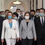 In this photo released by the Taiwan Presidential Office, U.S. House Speaker Nancy Pelosi, left, and Taiwanese President President Tsai Ing-wen arrive for a meeting in Taipei, Taiwan, Wednesday, Aug. 3, 2022. U.S. House Speaker Nancy Pelosi, meeting top officials in Taiwan despite warnings from China, said Wednesday that she and other congressional leaders in a visiting delegation are showing they will not abandon their commitment to the self-governing island. (Taiwan Presidential Office via AP)