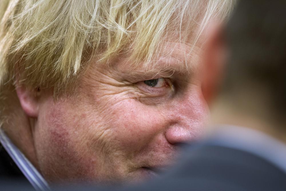 FILE – British Foreign Minister Boris Johnson participates in the Meeting of the Ministers of the Global Coalition on the Defeat of ISIS, Wednesday, March 22, 2017, at the State Department in Washington. The moving vans have already started arriving in Downing Street, as Britain’s Conservative Party prepares to evict Johnson. Debate about what mark he will leave on his party, his country and the world will linger long after he departs in September. (AP Photo/Cliff Owen, File)