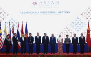 In this photo released by the Agence Kampuchea Press (AKP), Chinese Foreign Minister Wang Yi, fifth from left, poses for a group photo with ASEAN Foreign Ministers during the ASEAN Foreign Ministers Meeting in Phnom Penh, Cambodia, Thursday, Aug. 4, 2022. (AKP via AP)