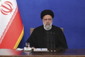 In this photo released by the official website of the office of the Iranian Presidency, President Ebrahim Raisi sits during his press conference in Tehran, Iran, Monday, Aug. 29, 2022. Raisi warned that any roadmap to restore Tehran’s tattered nuclear deal with world powers must see international inspectors end their probe on man-made uranium particles found at undeclared sites in the country. (Iranian Presidency Office via AP)