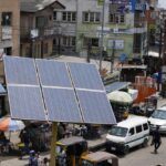 A solar panel sits near a street in the Ojuelegba neighborhood of Lagos, Nigeria, Saturday, Aug. 20, 2022. Access to more and cleaner energy while continuing to grow economically will be a top priority for African nations in the upcoming United Nations climate conference in November, top officials and climate experts on the continent said. (AP Photo/Sunday Alamba)