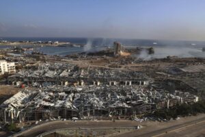 FILE – Smoke rises from the scene of an explosion that hit the seaport of Beirut, Lebanon, Wednesday, Aug. 5, 2020. It has been two years since a warehouse full of ammonium nitrate at Beirut’s port exploded, destroying large parts of the city, killing more than 215 people and injuring thousands. In 2022 many families are losing hope of ever finding justice. (AP Photo/Bilal Hussein, File)