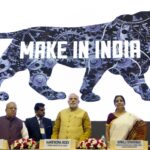 FILE – Indian Prime Minister Narendra Modi, center, unveils the logo of ‘Make in India’ initiative in New Delhi, India, Sept. 25, 2014. India’s phenomenal transformation from an impoverished nation in 1947 into an emerging global power whose $3 trillion economy is Asia’s third largest has made it a major exporter of things like software and vaccines. The country marks 75 years of independence from British rule on Aug. 15. (AP Photo/Saurabh Das, File)