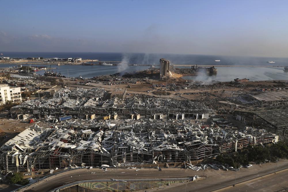 FILE – Smoke rises from the scene of an explosion that hit the seaport of Beirut, Lebanon, Wednesday, Aug. 5, 2020. It has been two years since a warehouse full of ammonium nitrate at Beirut’s port exploded, destroying large parts of the city, killing more than 215 people and injuring thousands. In 2022 many families are losing hope of ever finding justice. (AP Photo/Bilal Hussein, File)