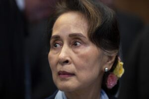 FILE – Myanmar’s leader Aung San Suu Kyi waits to address judges of the International Court of Justice in The Hague, Netherlands, Dec. 11, 2019. A Myanmar court convicted Suu Kyi in more corruption cases Monday, Aug. 15, 2022, adding six years to prison sentence. (AP Photo/Peter Dejong, File)