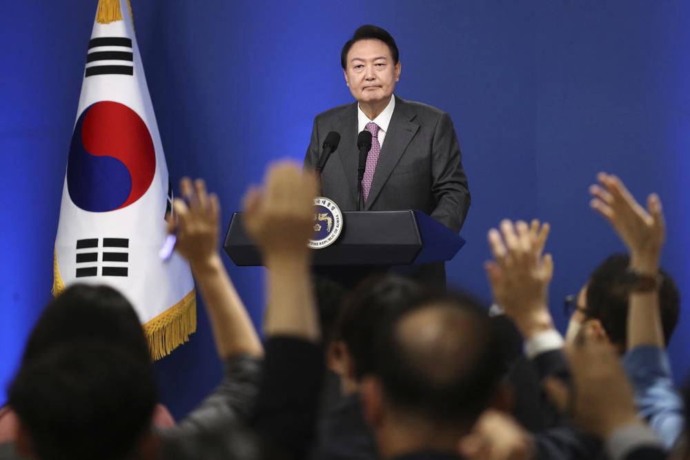 South Korean President Yoon Suk Yeol takes a question during a news conference to mark his first 100 days in office at the presidential office in Seoul, South Korea, Wednesday, Aug. 17, 2022. (Chung Sung-Jun/Pool Photo via AP)