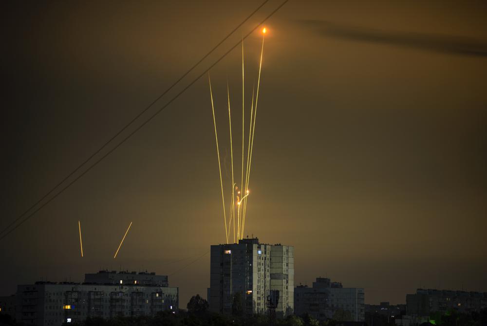 Russian rockets launch against Ukraine from Russia’s Belgorod region are seen at dawn in Kharkiv, Ukraine, early Saturday, Aug. 20, 2022. (AP Photo/Vadim Belikov)