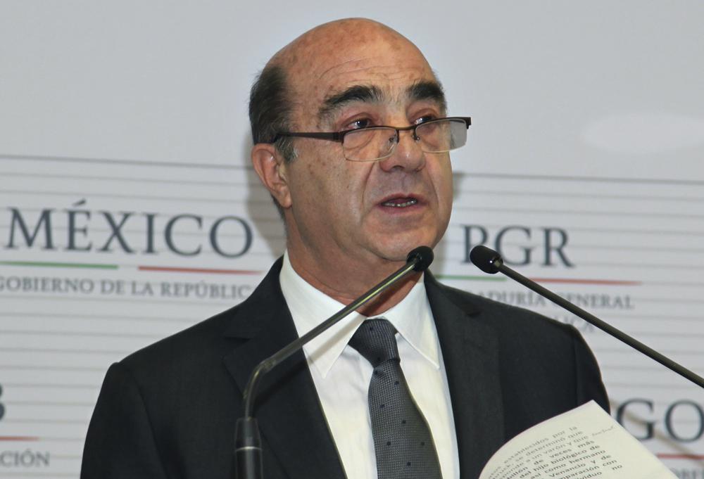 FILE – Mexico’s Attorney General Jesus Murillo Karam gives a news conference in Mexico City, Dec. 7, 2014. The Mexican Attorney General’s Office reported on Friday, Aug. 19, 2022, it has detained Murillo Karam, who was in charge of the investigation into the disappearance of the 43 student teachers that occurred in southern Mexico in 2014. (AP Photo/Marco Ugarte, File)