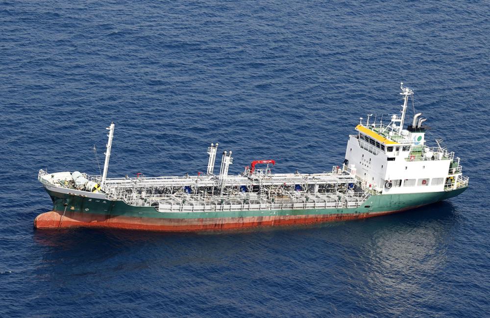This aerial photo shows Japanese chemical tanker Ryoshinmaru after a collision, off Kushimoto, Wakayama prefecture, southwestern Japan, Saturday, Aug. 20, 2022. The Japanese chemical tanker ship crashed into a cargo ship off the coast of southwestern Japan, the coast guard said Saturday.(Kyodo News via AP)