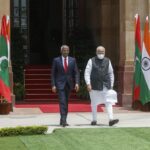 Maldives President Ibrahim Mohamed Solih, left and Indian Prime Minister Narendra Modi arrive to pose for the media before their meeting in New Delhi, India, Tuesday, Aug.2, 2022. (AP Photo)