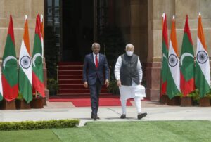 Maldives President Ibrahim Mohamed Solih, left and Indian Prime Minister Narendra Modi arrive to pose for the media before their meeting in New Delhi, India, Tuesday, Aug.2, 2022. (AP Photo)