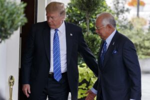 FILE – US President Donald Trump greets Malaysian Prime Minister Najib Razak at the White House, Sept. 12, 2017, in Washington. Najib Razak on Tuesday, Aug. 23, 2022 was Malaysia’s first former prime minister to go to prison — a mighty fall for a veteran British-educated politician whose father and uncle were the country’s second and third prime ministers, respectively. The 1MDB financial scandal that brought him down was not just a personal blow but shook the stranglehold his United Malays National Organization party had over Malaysian politics.(AP Photo/Evan Vucci, file)