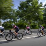 Yang Lan, second from left, and other members of the Qiyi bicycle club ride along a rural road during a group ride through the Baihe River Canyon in the northern outskirts of Beijing, Wednesday, July 13, 2022. Cycling has gained increasing popularity in China as a sport. A coronavirus outbreak that shut down indoor sports facilities in Beijing earlier this year encouraged people to try outdoor sports including cycling, which was only a major tool of transport before 2000. (AP Photo/Mark Schiefelbein)