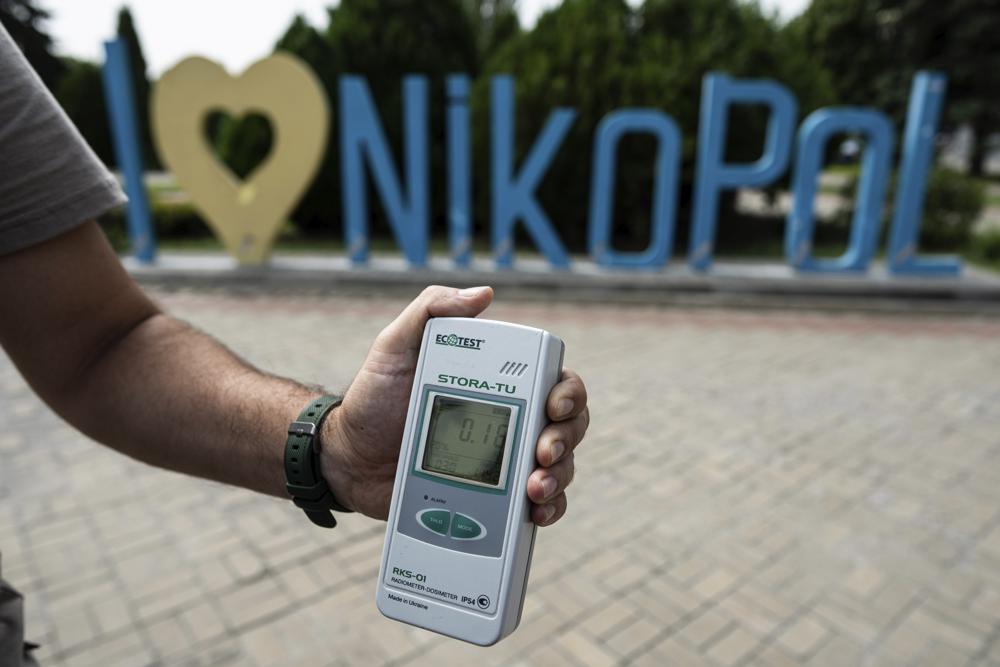 FILE – A Geiger counter shows increased radiation level in Nikopol, Ukraine, Aug, 22, 2022. Ukrainians are once again anxious and alarmed about the fate of a nuclear power plant in a land that was home to the world’s worst atomic accident in 1986 at Chernobyl. The Zaporizhzhia nuclear plant, Europe’s largest, has been occupied by Russian forces since early in the war, and continued fighting nearby has heightened fears of a catastrophe that could affect nearby towns in southern Ukraine or beyond. (AP Photo/Evgeniy Maloletka, File)