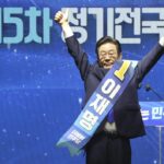 South Korean lawmaker Lee Jae-myung gestures after he was elected as a South Korea’s main opposition Democratic Party’s chairperson during the party’s convention in Seoul, South Korea, Sunday, Aug. 28, 2022. (Korea Pool/Yonhap via AP)