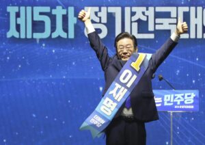 South Korean lawmaker Lee Jae-myung gestures after he was elected as a South Korea’s main opposition Democratic Party’s chairperson during the party’s convention in Seoul, South Korea, Sunday, Aug. 28, 2022. (Korea Pool/Yonhap via AP)