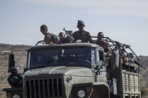FILE – Ethiopian government soldiers ride in the back of a truck on a road near Agula, north of Mekele, in the Tigray region of northern Ethiopia on May 8, 2021. Authorities in Ethiopia’s northern Tigray region alleged Wednesday, Aug. 24, 2022 that Ethiopia’s military launched a “large-scale” offensive for the first time in a year, while Ethiopia’s military spokesman did not immediately respond to questions. (AP Photo/Ben Curtis, File)
