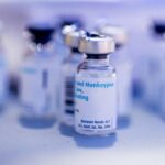 Vials of empty monkeypox vaccines sit at a table at Seattle Central College in Seattle, Saturday, Aug. 6, 2022. (Daniel Kim/The Seattle Times via AP)
