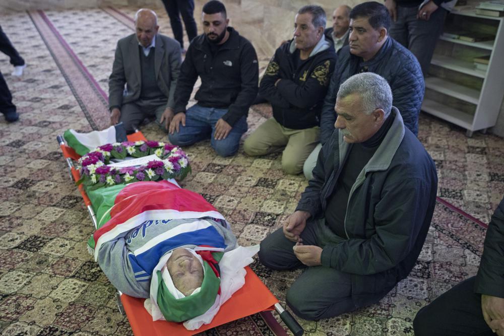 FILE – Mourners pray for 78-year-old Palestinian-American Omar Assad, during his funeral at a mosque, in the West Bank village of Jiljiliya, north of Ramallah, Jan. 13, 2022. Assad died shortly after Israeli soldiers bound and blindfolded him and left him in the cold. In that case, senior officers were reprimanded and stripped of leadership roles. At least 85 Palestinians have been killed in the West Bank this year as Israeli forces have carried out nightly raids in cities, towns and villages, making it the deadliest in the occupied territory since 2016. (AP Photo/Nasser Nasser, File)